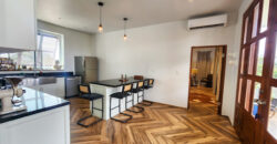 Upscale Two-Bedroom Rental with Expansive Veranda